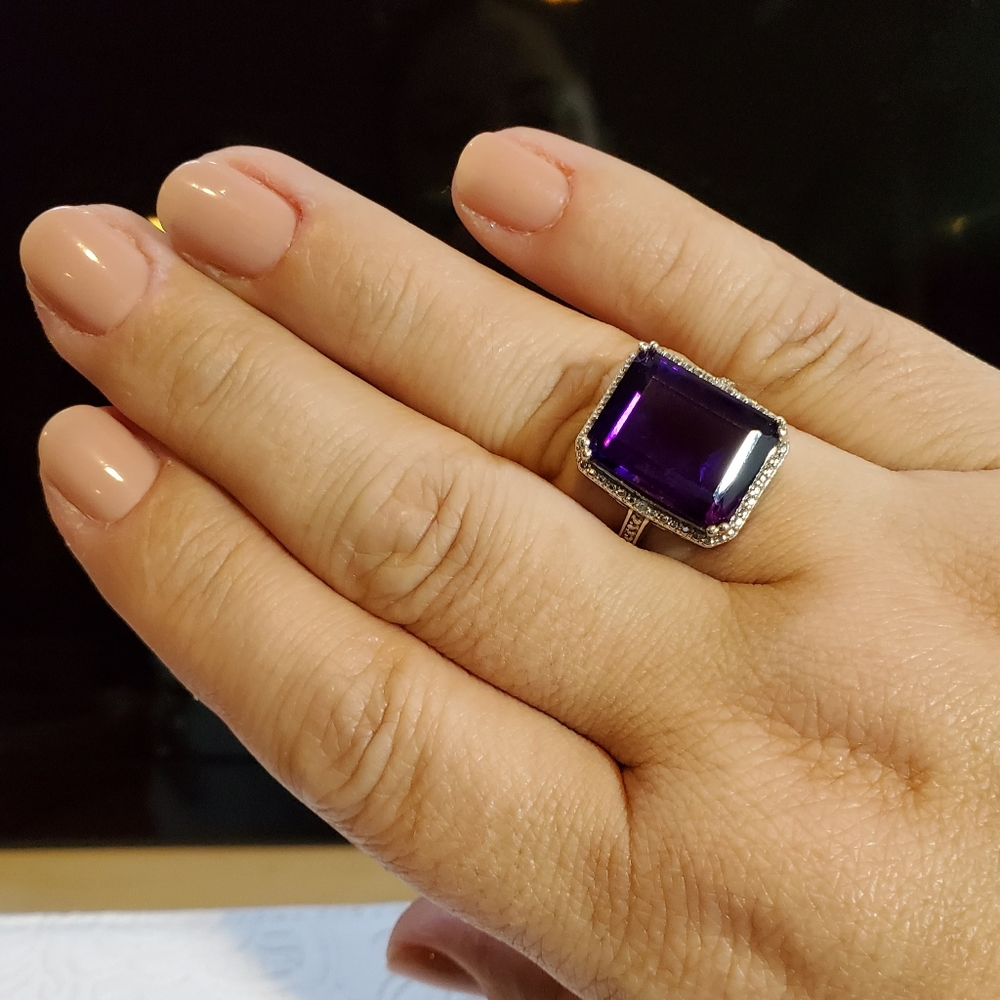 Amazingly ample Amethyst emerald cut halo set ring